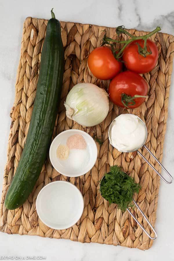 photo of ingredients: cucumber, tomatoes, onion, sour cream, seasonings.