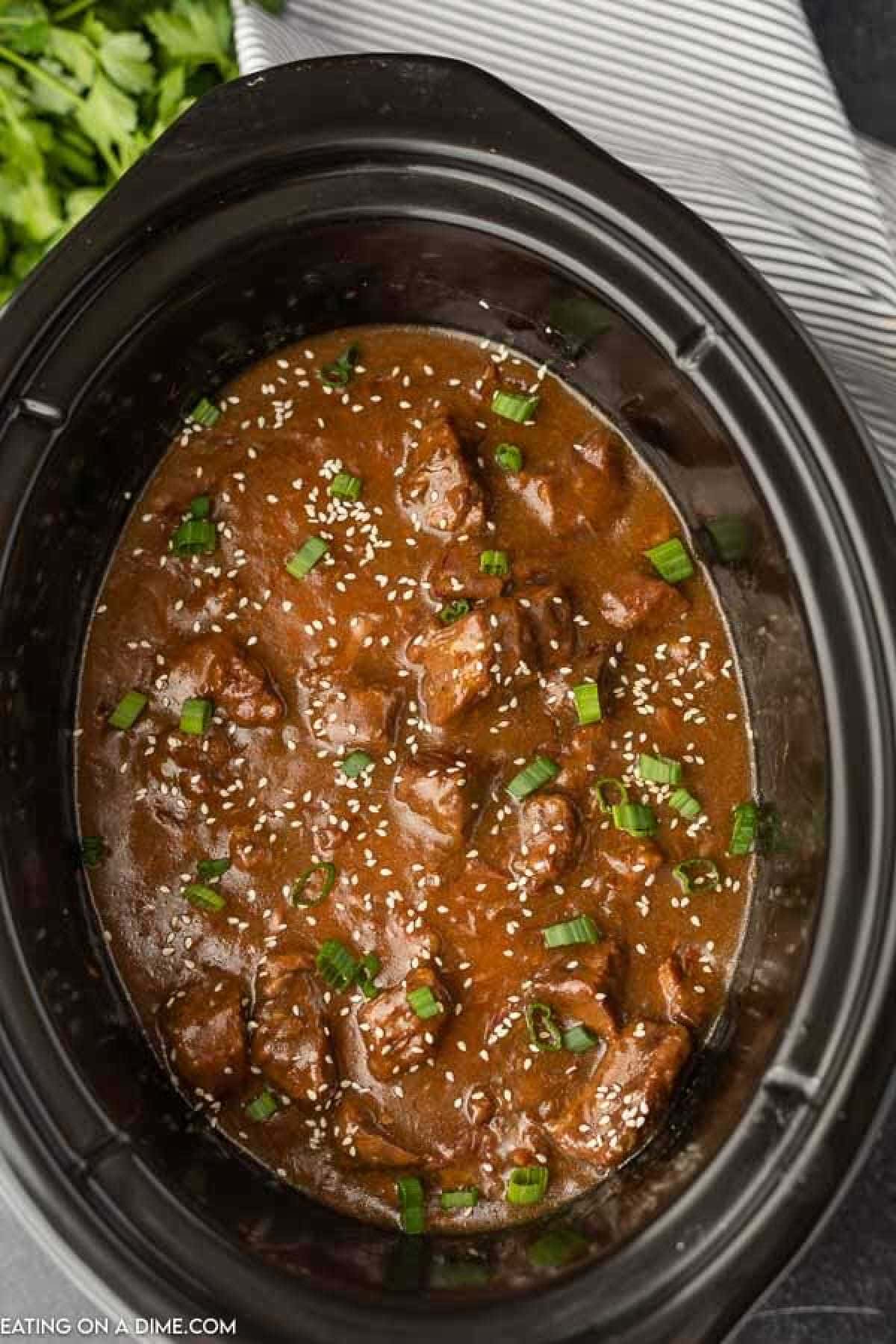 Try Crock pot beef teriyaki recipe for a simple and delicious dinner idea. This beef teriyaki stir fry recipe does not disappoint. Everyone will love Slow cooker teriyaki beef recipe. Once you know how to make beef teriyaki, it will be on your regular menu plan! Try simple teriyaki beef recipe. A slow cooker with beef teriyaki in it.
