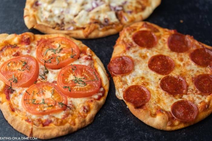 Close up image of a three different type of flatbread pizzas. 