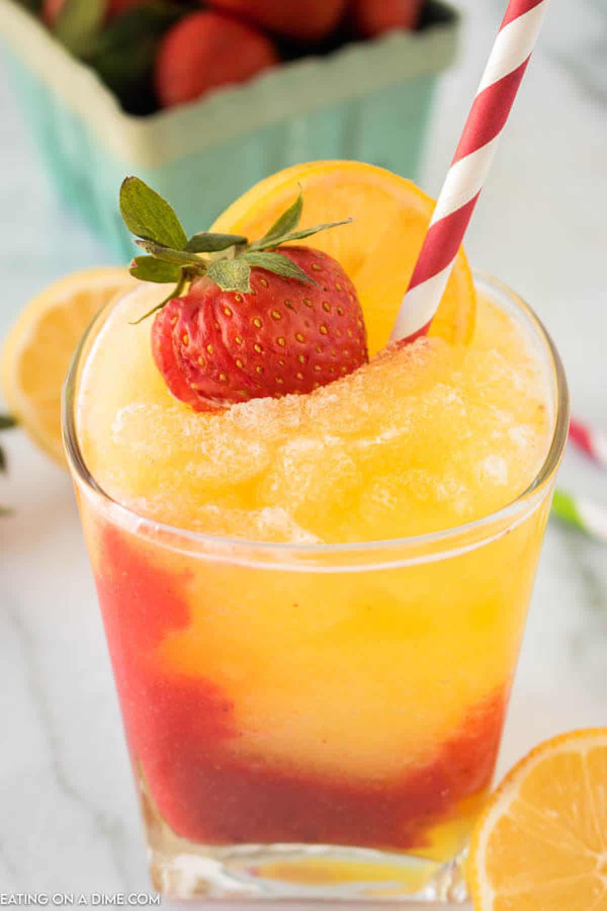 Closeup picture of frozen strawberry lemonade in glass.