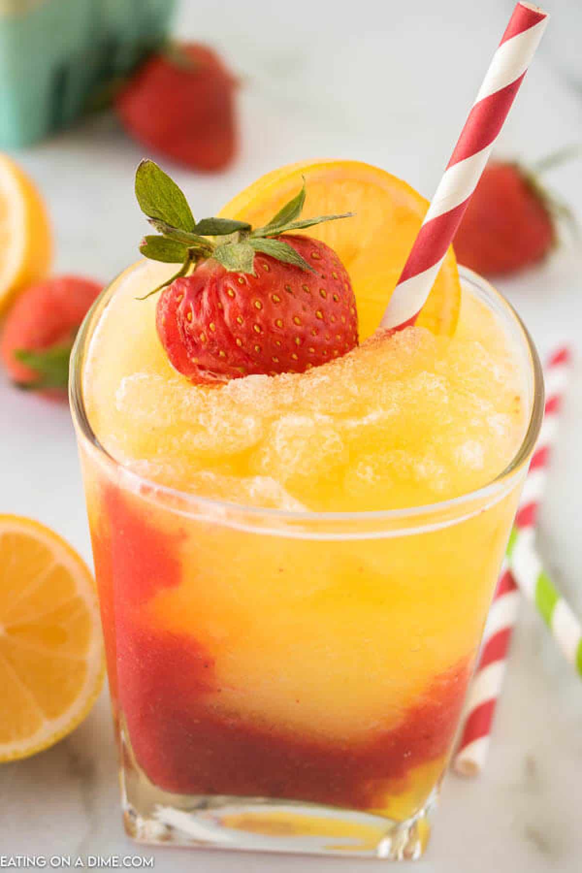 Closeup picture of frozen strawberry lemonade in glass. 