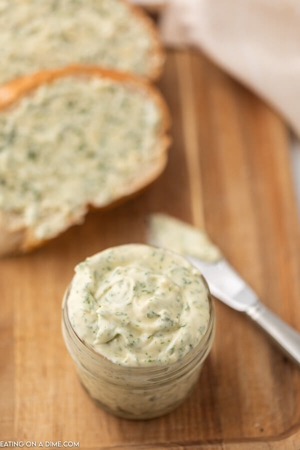 picture of garlic butter and bread in the background