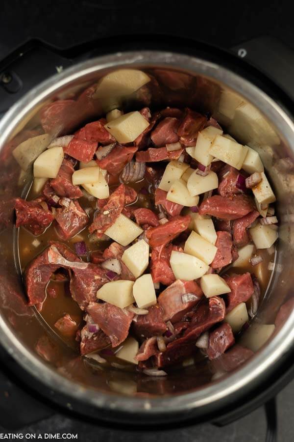 Uncooked beef and potatoes in the instant pot