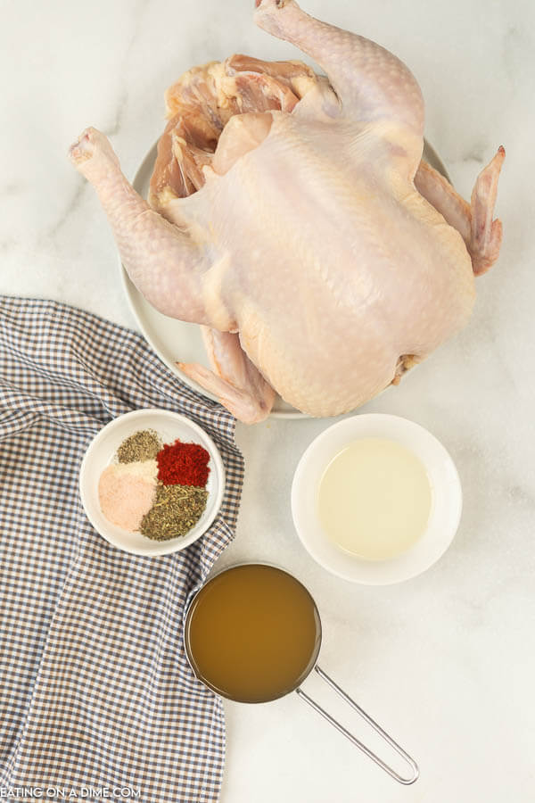 picture of ingredients: whole chicken, seasonings, chicken broth, oil. 