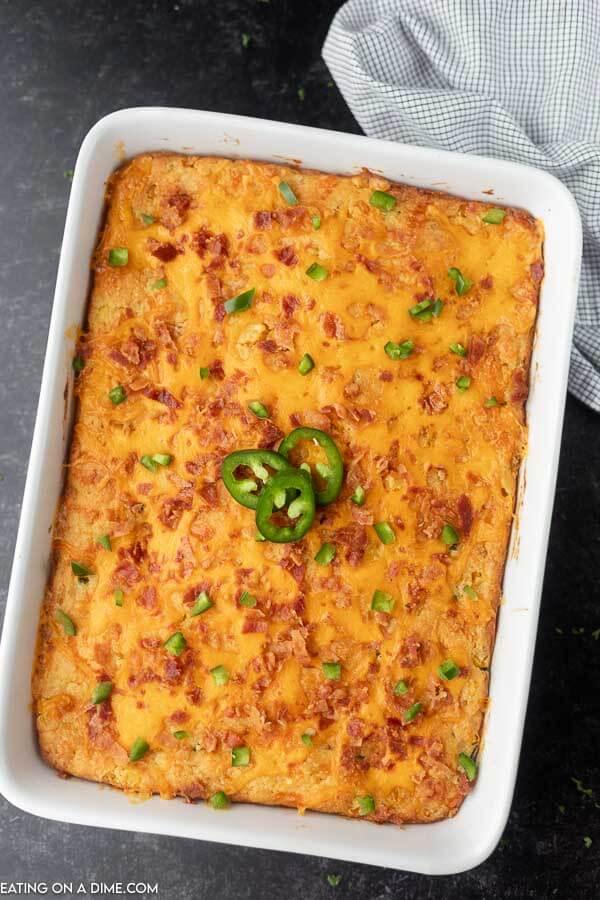 Overview of this Jalapeño Popper Corn Casserole in a white casserole pan.  