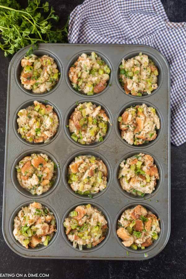 Dividing the mixture into the muffin tins