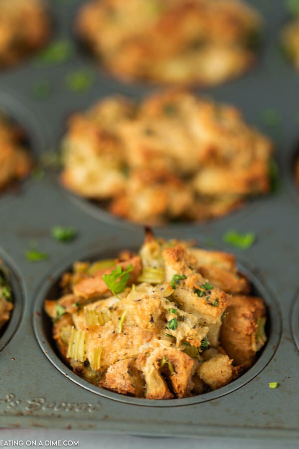 muffin tin with cooked stuffing muffins