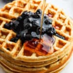 Waffles with blueberry syrup.