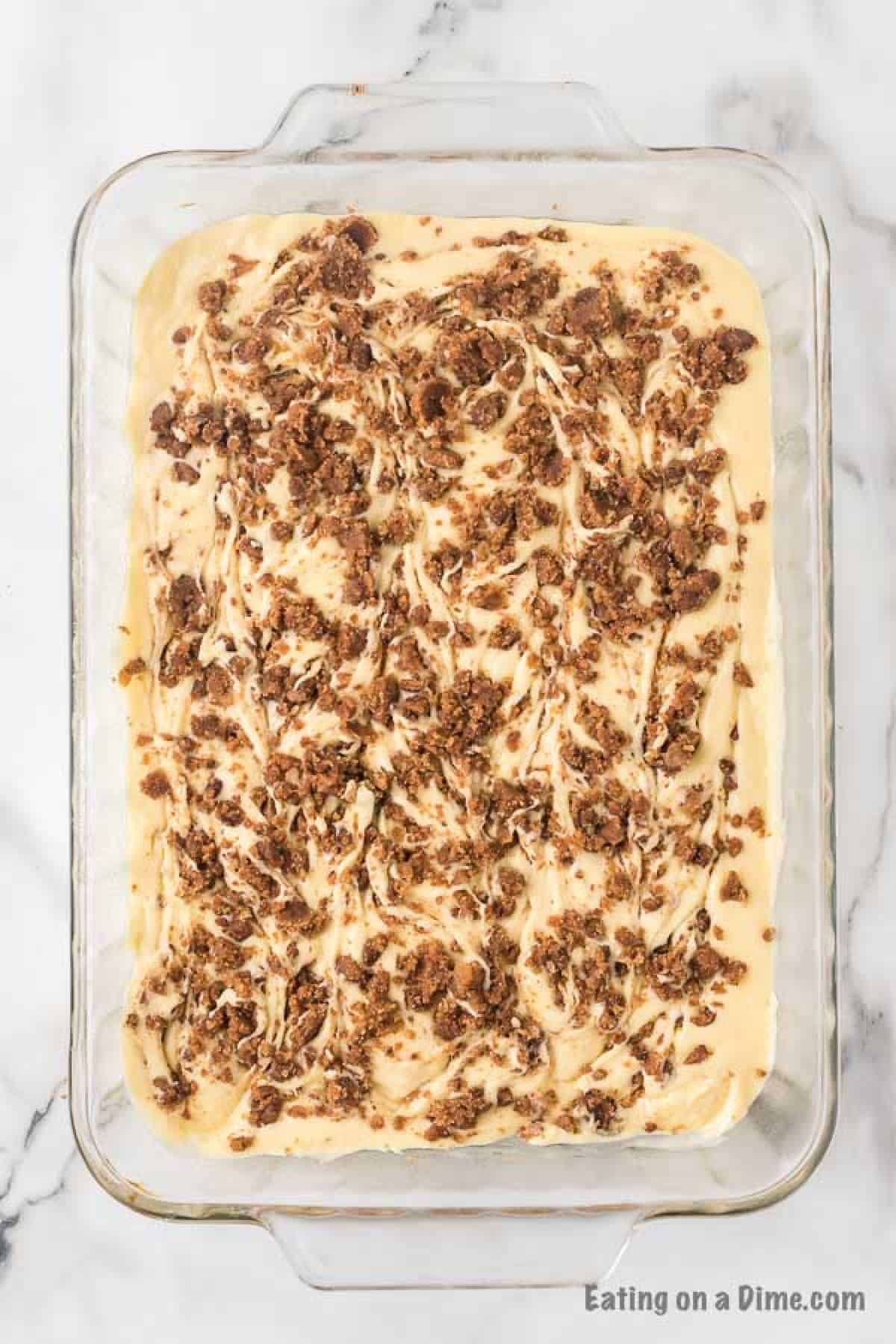 The cinnamon topping swirled into the cake batter in the pan with a knife.