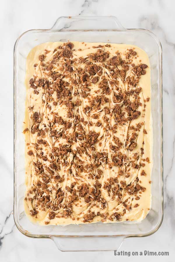 The cinnamon topping swirled into the cake batter in the pan with a knife.  