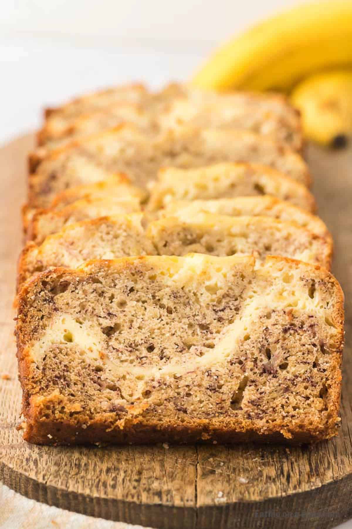 slices of cream cheese banana bread on cutting board