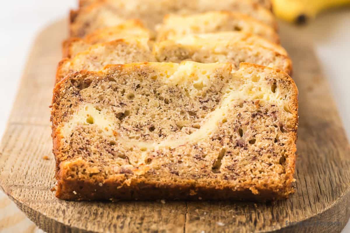 slices of cream cheese banana bread on cutting board