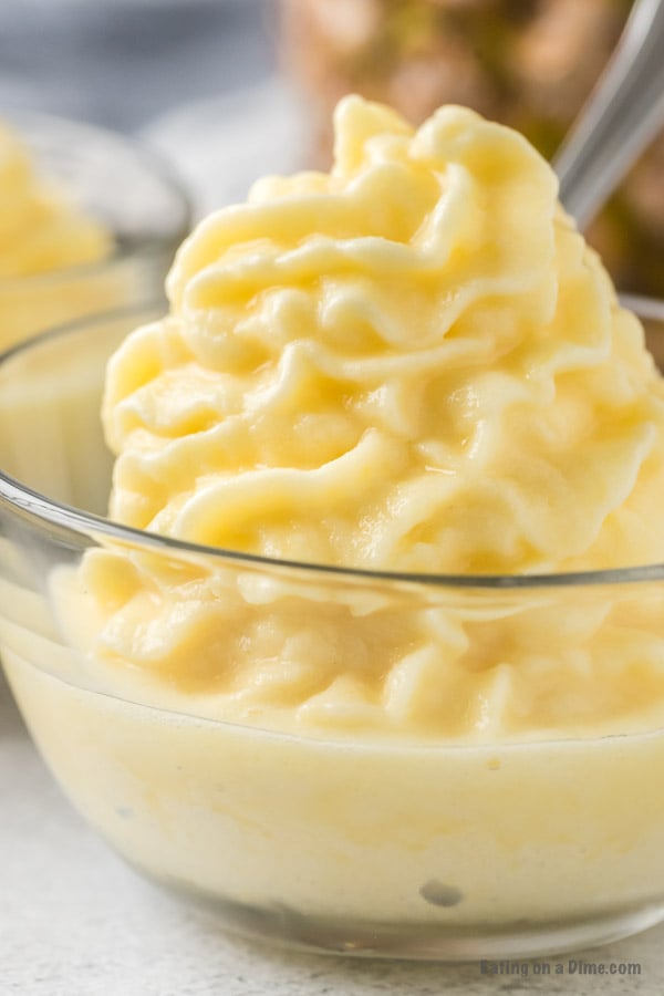 close up image of dole whip in a clear bowl 