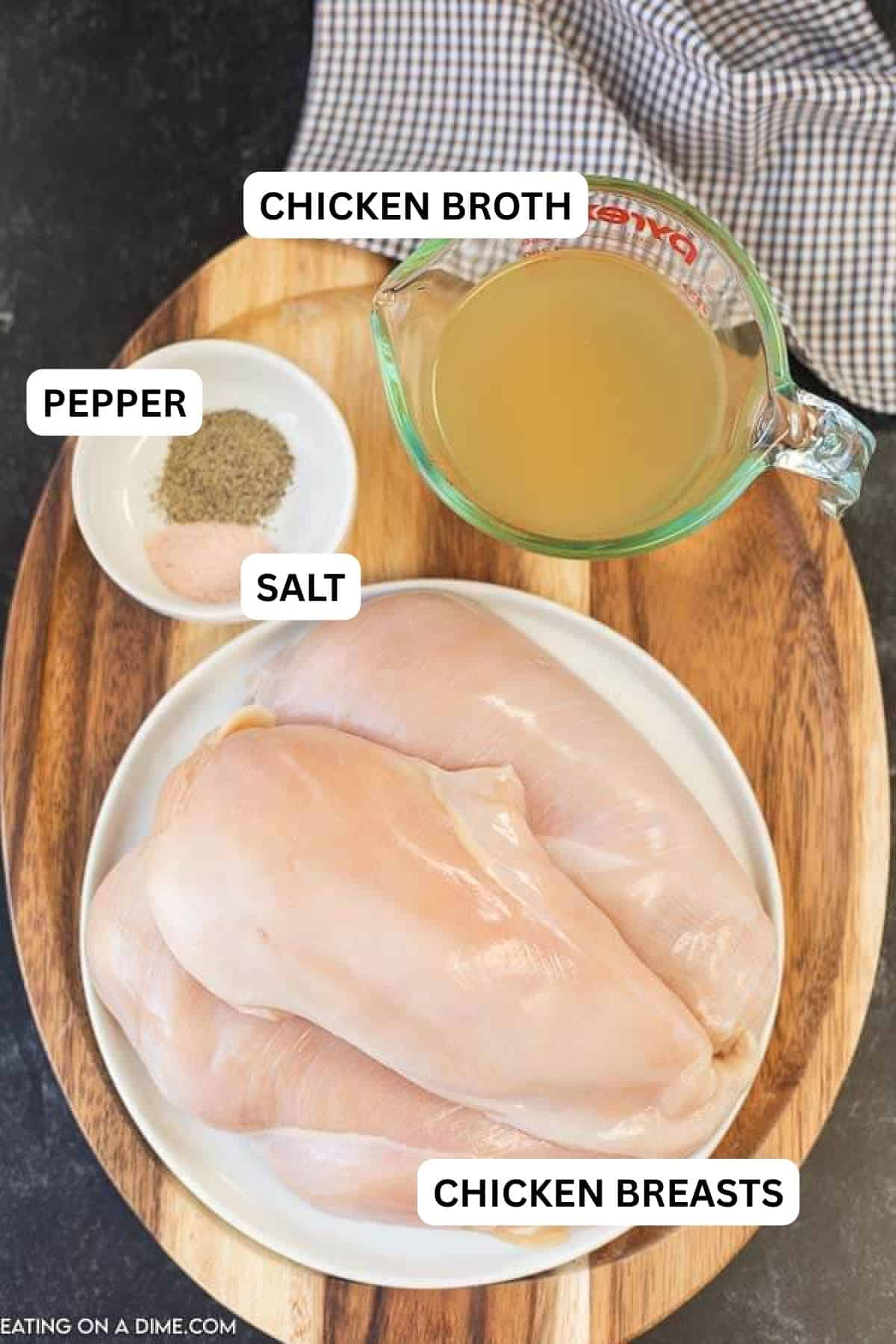 The ingredients required to make the recipe on a wooden board.