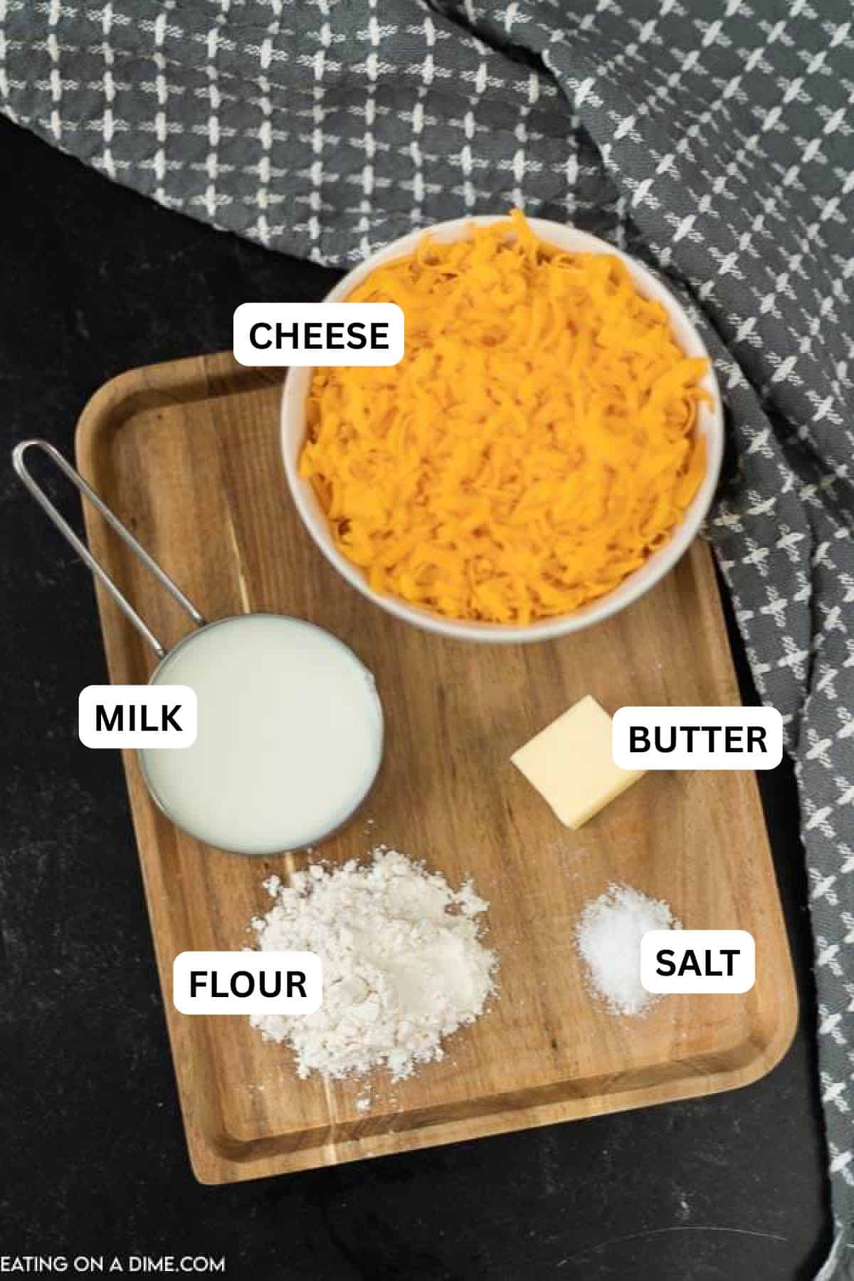 Picture of ingredients: shredded cheese, milk, flour, butter.