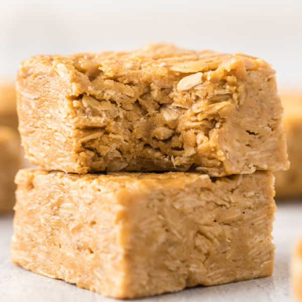 Close up image of Peanut Butter Oat Bars stacked. 