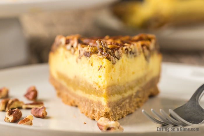 slice of pecan pie cheesecake on a plate
