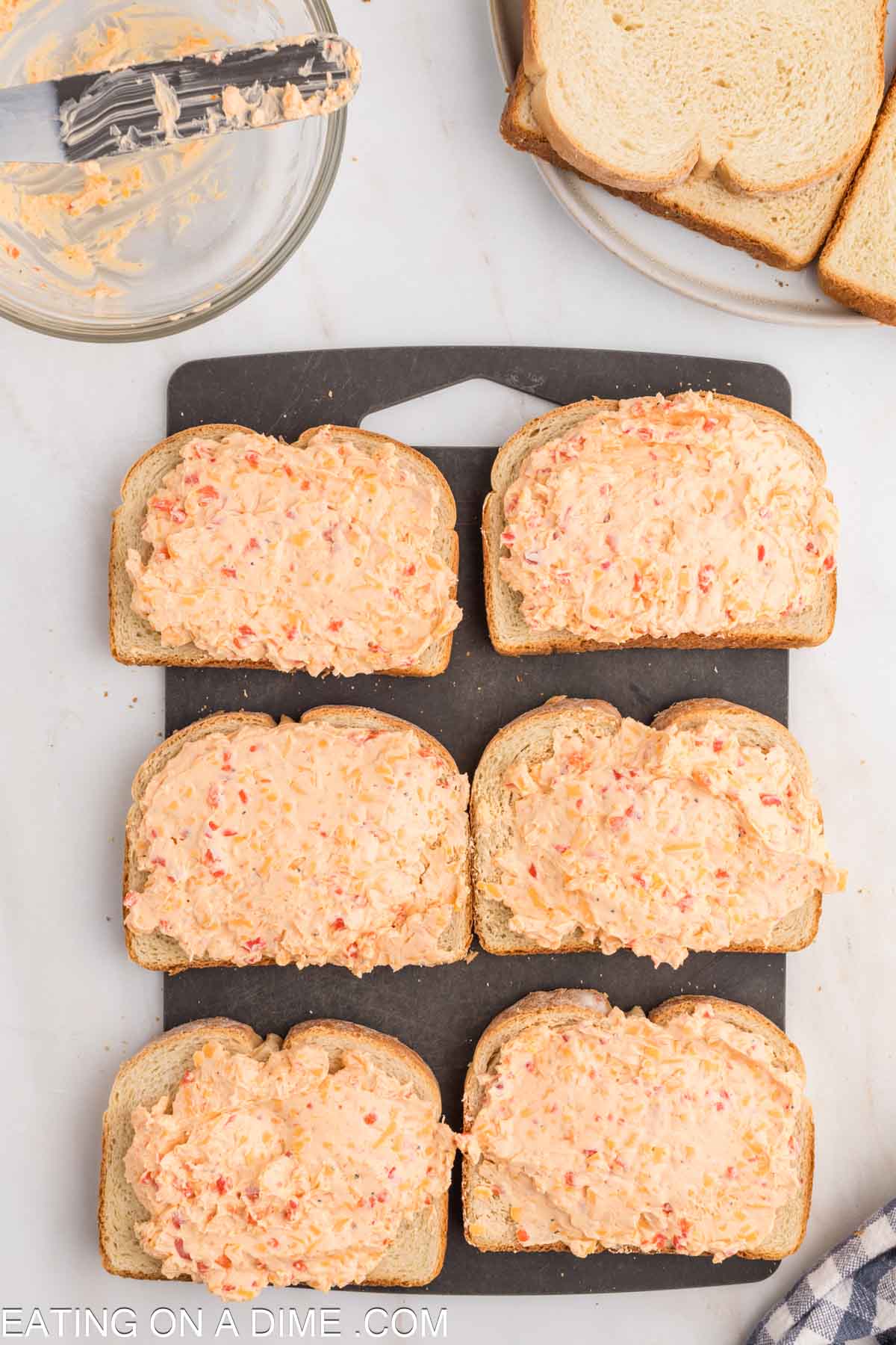 Slices of bread topped with pimento cheese spread