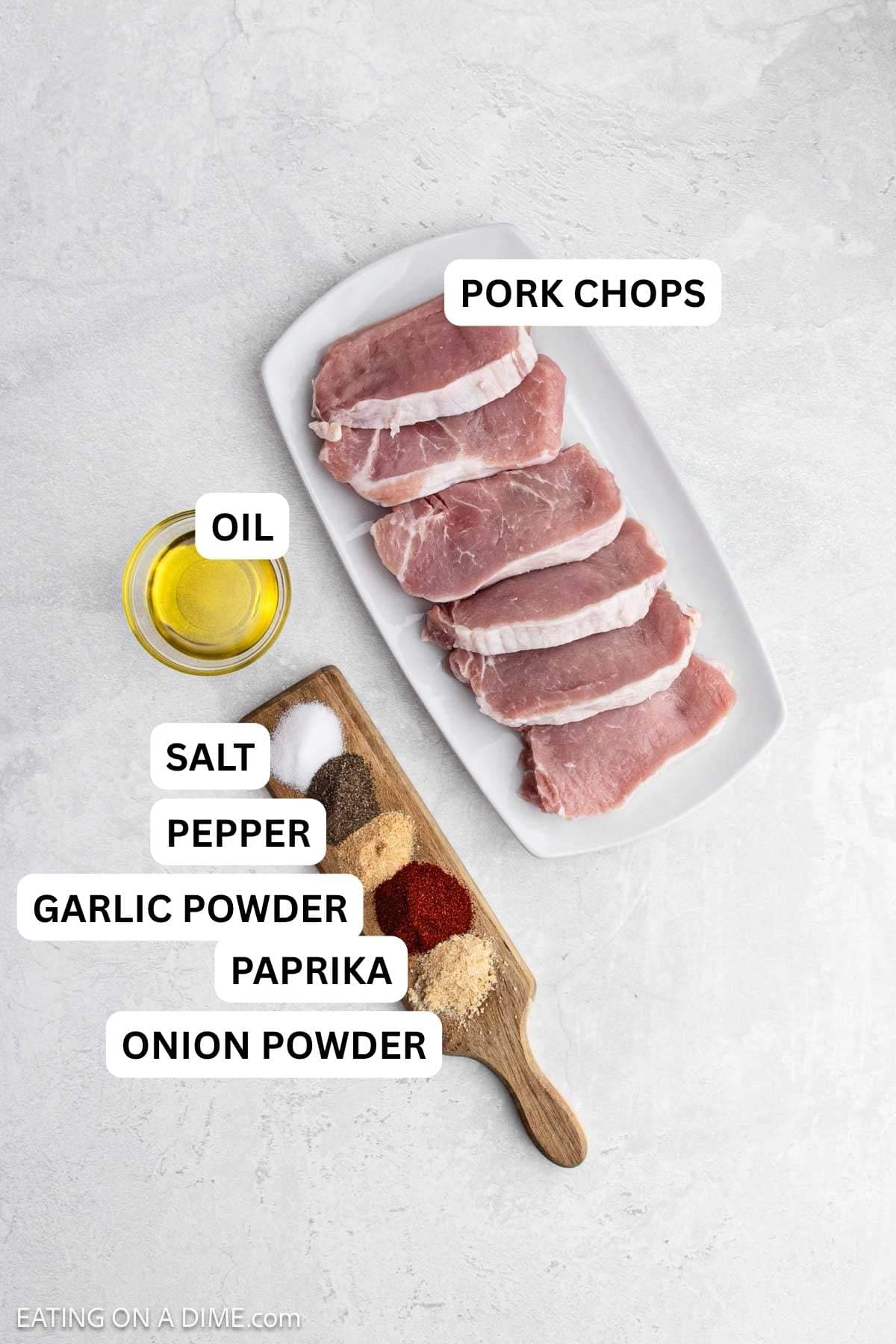 Ingredients needed to make this recipe which includes boneless pork chops, oil, and variety of spices. 
