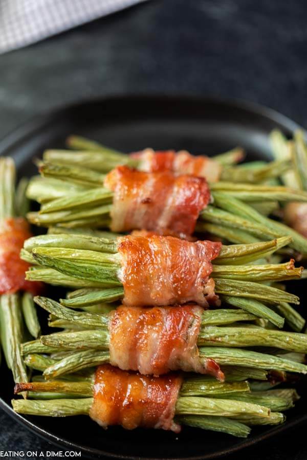 green beans wrapped in bacon on platter