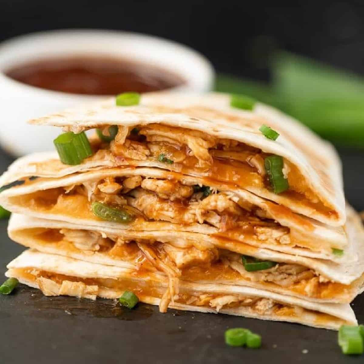 BBQ Chicken Quesadillas stacked together.