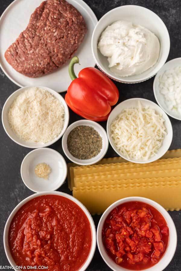 Image of ingredients needed for lasagna soup - beef, onion, red bell pepper, diced tomatoes, crushed tomatoes, minced garlic, italian seasoning, beef broth, rotini pasta
ricotta cheese, mozzarella cheese, parmesan cheese