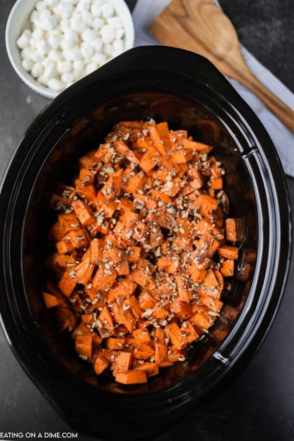 diced sweet potatoes in crock pot ready to be cooked