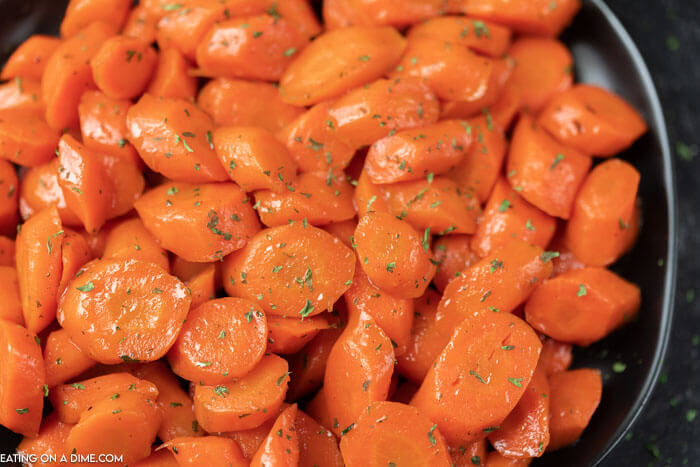 Close up image of Brown Sugar Glazed Carrots in a skillet. 