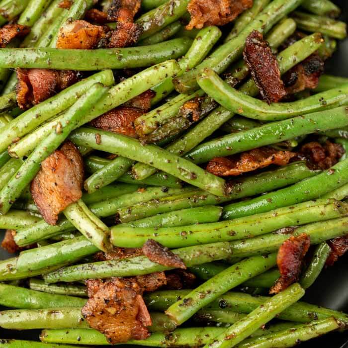 Make green beans with bacon for a savory and delicious side dish. With just a few ingredients, this recipe is simple but loaded with flavor. 