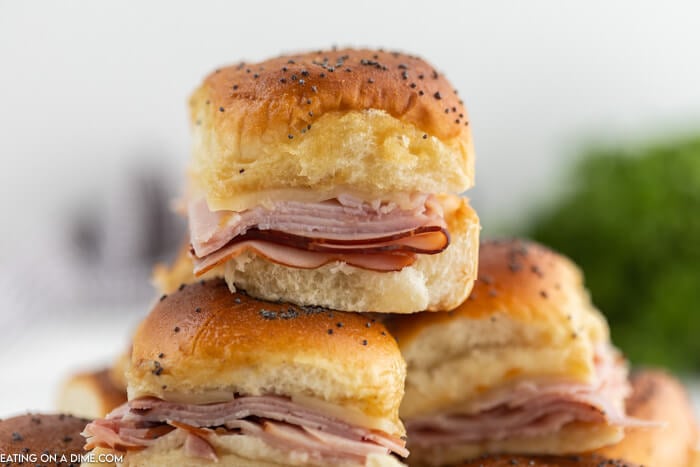 Close up image of Ham and Cheese sliders stacked. 