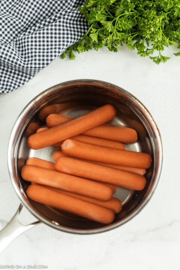 Hot dogs in a pan. 