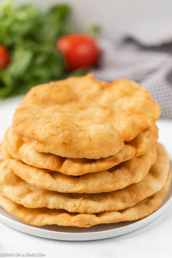 Indian fry bread stacked on a plate. 