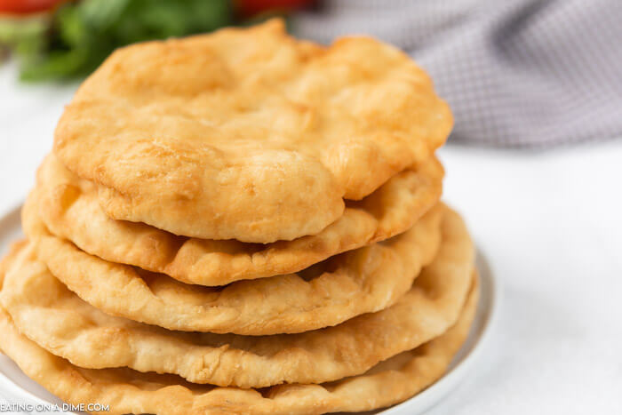 Indian fry bread stacked on a plate. 
