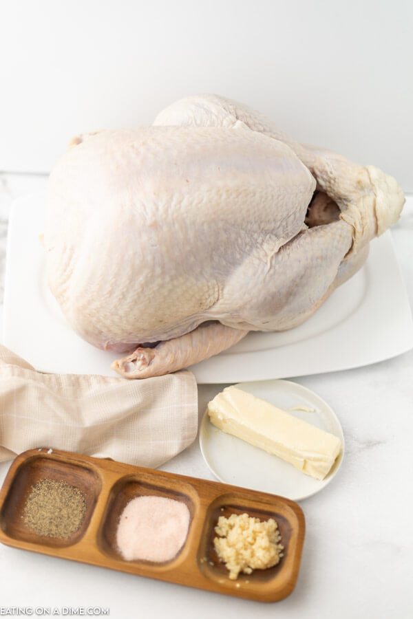 uncooked turkey and seasonings needed to cook turkey