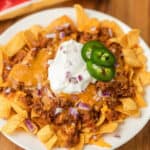 closeup picture of frito chili pie on plate