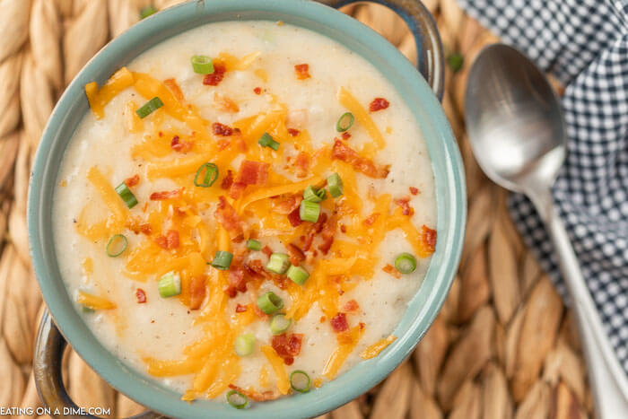 bowl of potato soup with toppings