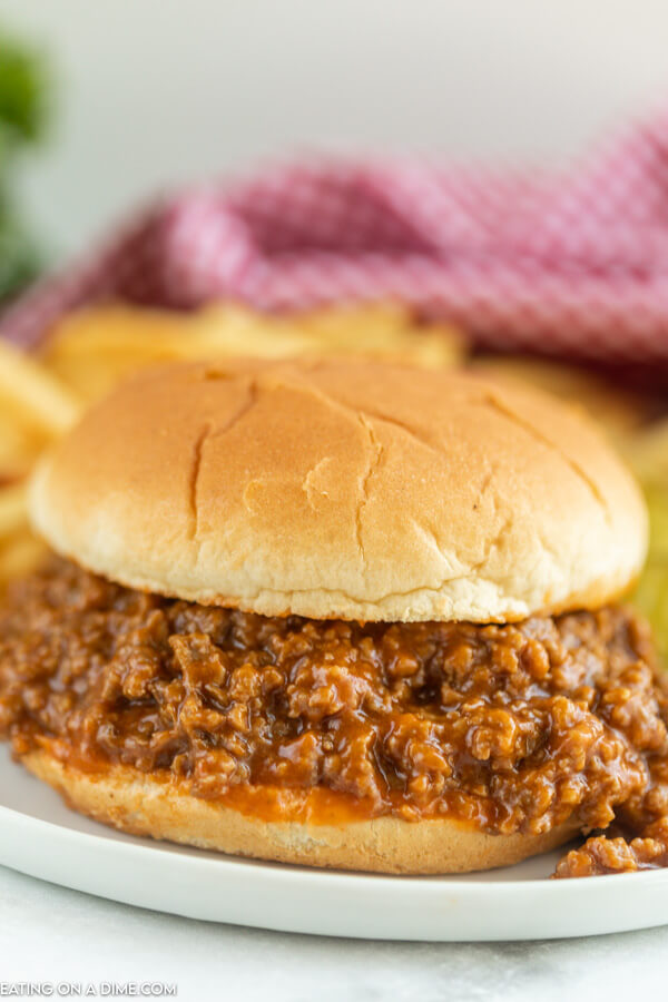 sloppy joes on a bun served on a white plate