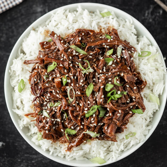 Korean bbq over rice on a plate