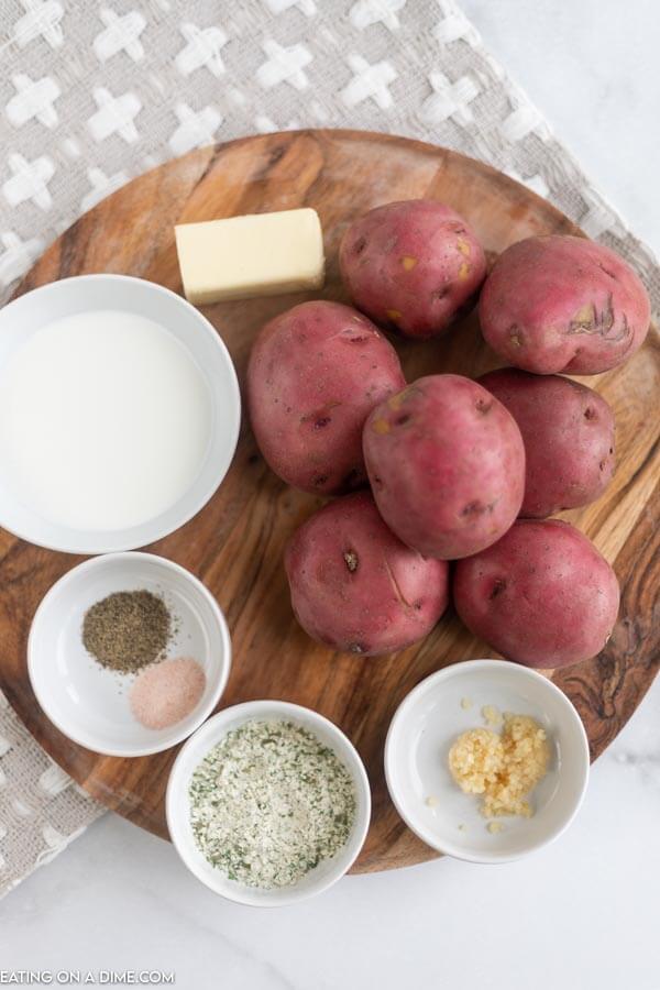 Ingredients need for garlic mashed potatoes - red potatoes, minced garlic, ranch seasoning, butter, milk and salt. 