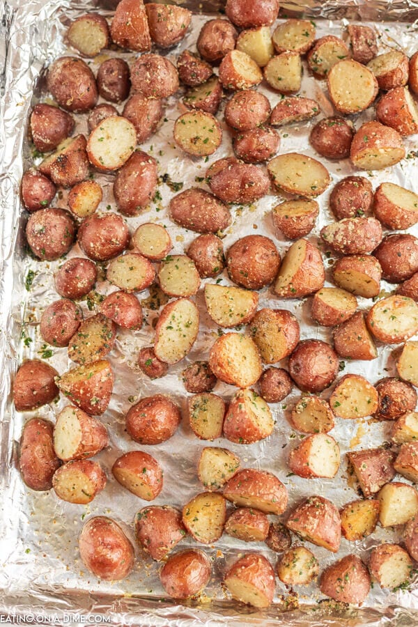 Roasted red potatoes on baking sheet lined with foil. 