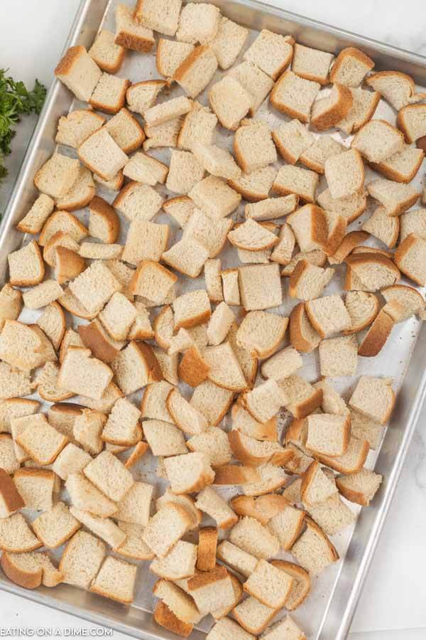 Close up image of pieces of bread on baking sheet