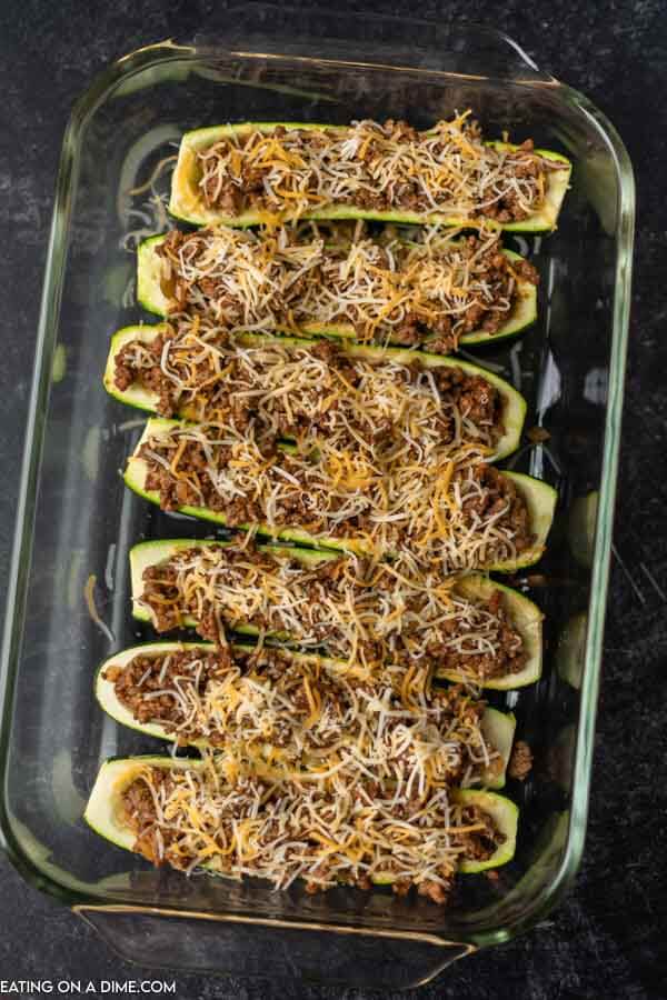 zucchini boats in baking dish ready to go in oven