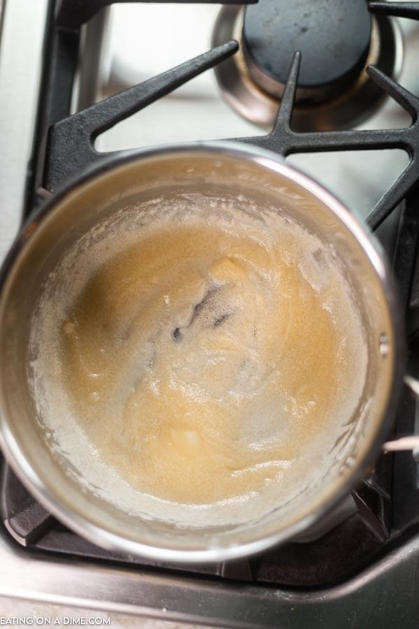 A saucepan with the butter and flour whisked together 