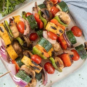 grilled vegetable skewers on a white plate