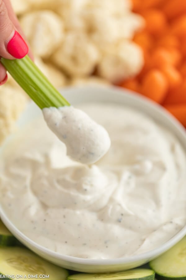bowl of ranch dip with celery for dipping