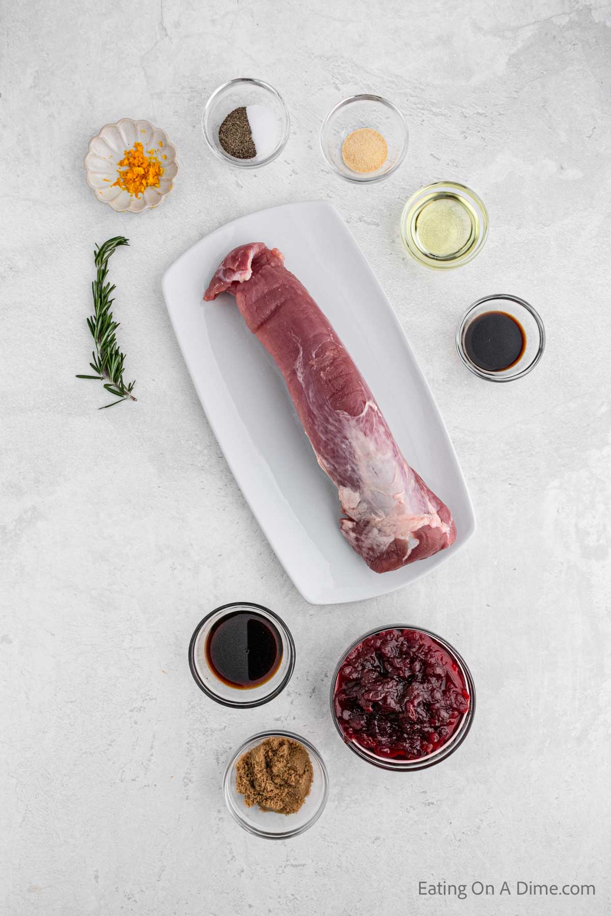 Cranberry Pork Tenderloin ingredients - pork tenderloin, salt and pepper, garlic powder, vegetable oil, cranberry sauce, soy sauce, balsamic vinegar, brown sugar, rosemary