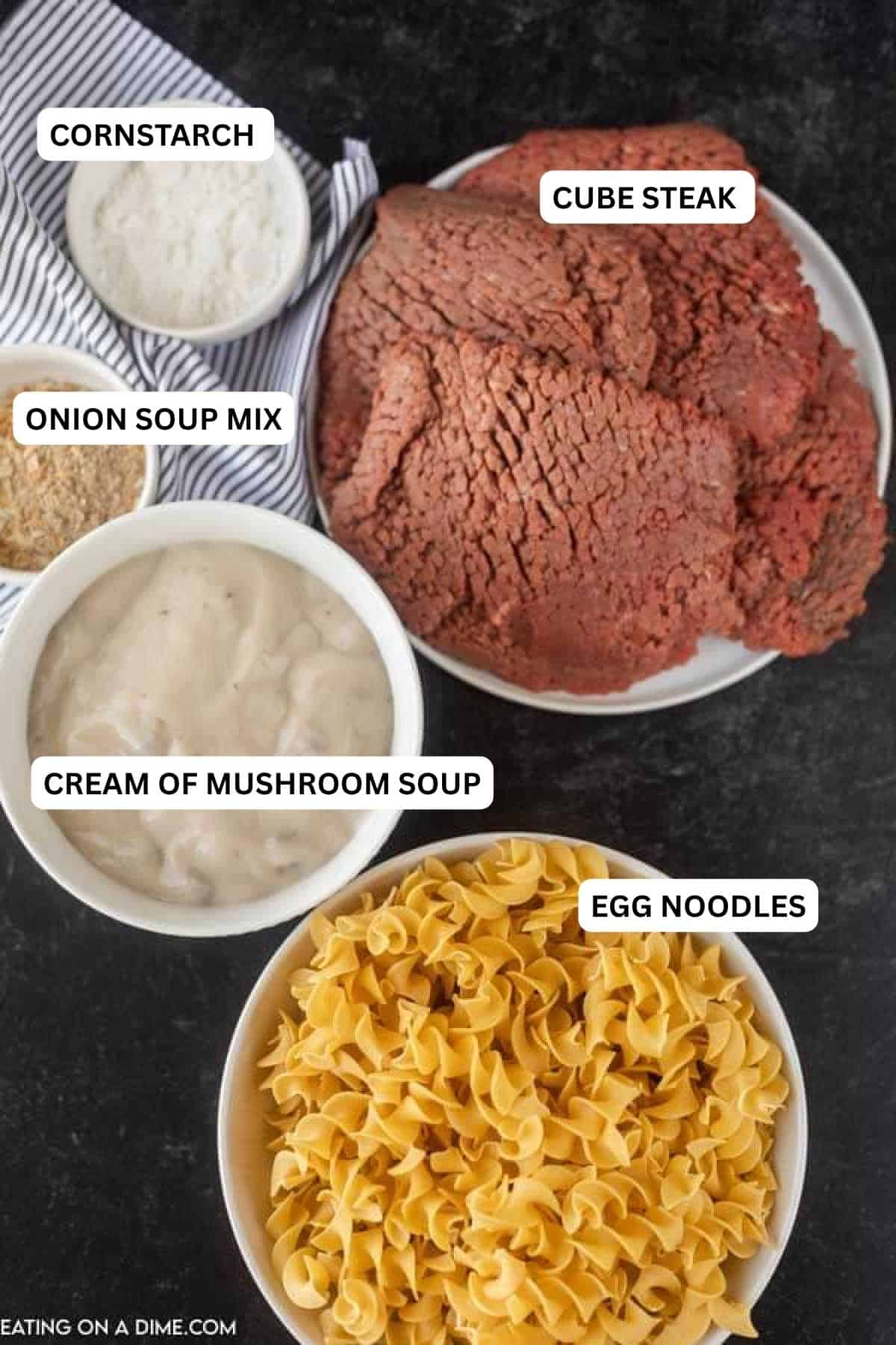 Ingredients for recipe - cornstarch, cube steak, onion soup mix, cream of mushroom soup, egg noodles.