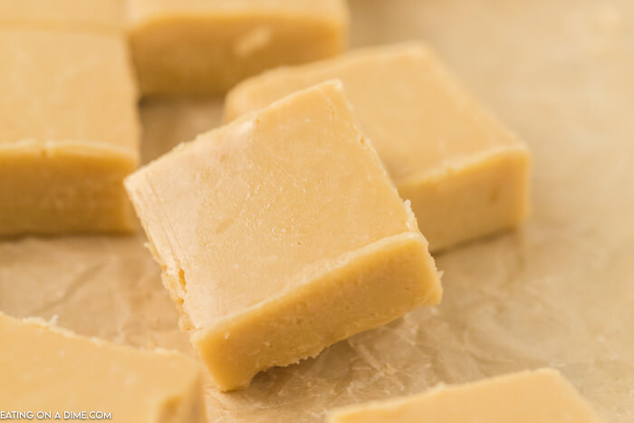 Close up of pieces of the caramel fudge on parchment paper 