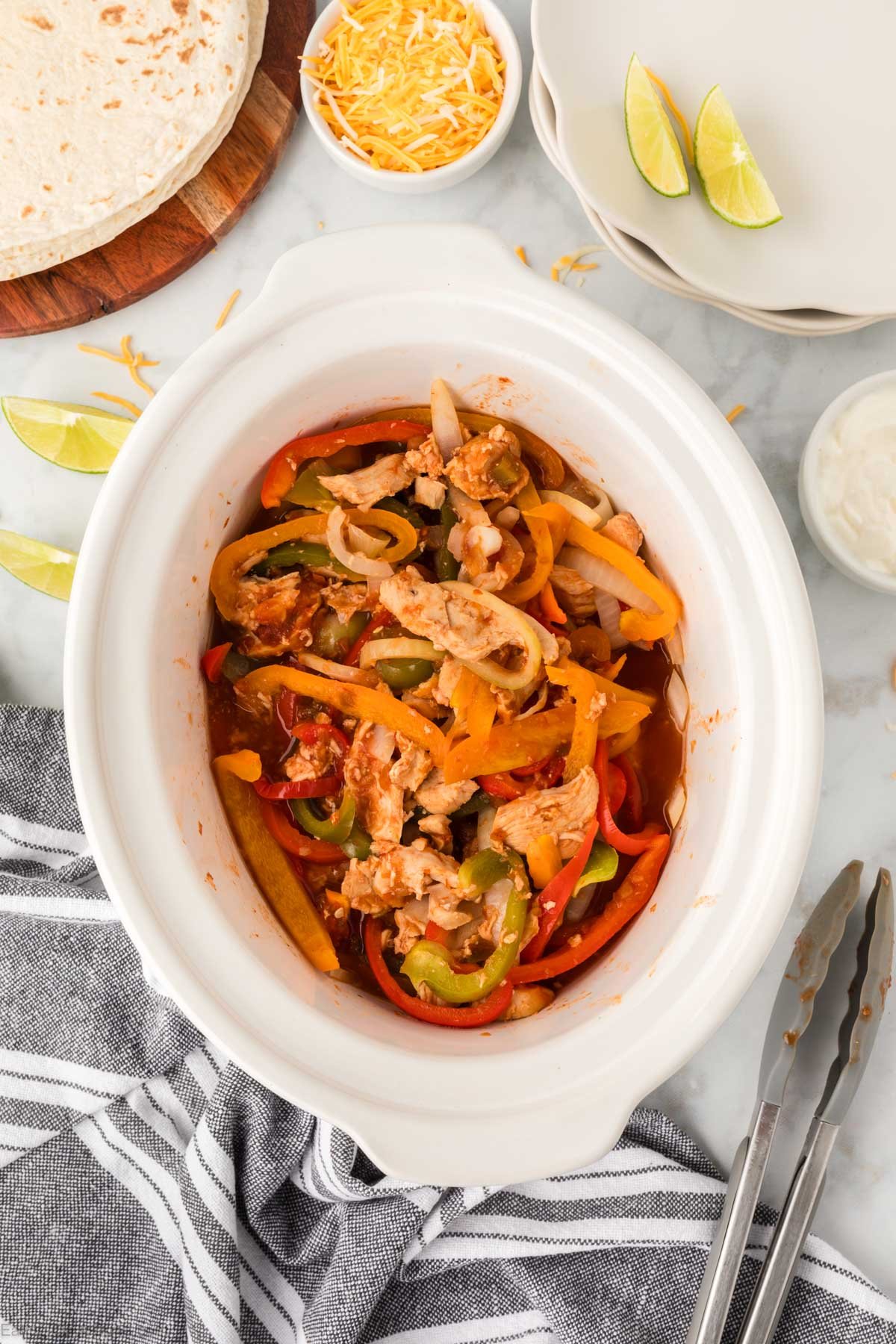 Crockpot Chicken Fajitas Recipe is so easy that you can make this any day of the week. Save time and money with this 4 ingredient meal!