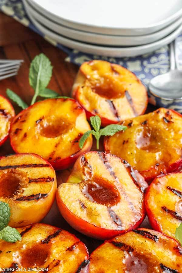 grilled peaches on cutting board